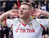  ?? ?? CROWD PLEASER Paul Mullins put Wrexham into the FA Trophy final yesterday with two goals against Stockport
