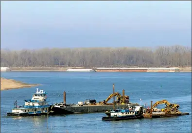  ?? AP/THE Southern Illinoisan/paul NEWTON ?? Boats from Newt Marine in Dubuque, Iowa, remove rocks from the bottom of the Mississipp­i River on Monday near Thebes, Ill., to deepen the channel.