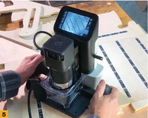  ??  ?? 5 The Shaper Origin is a handheld CNC router. It registers itself using marker tape and auto-adjusts to the programmed cut.