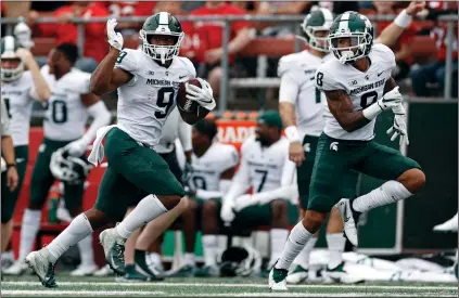  ?? (AP PHOTO/ADAM HUNGER) ?? Not only is Michigan State one of the most surprising teams in the Big Ten this season, but running back Kenneth Walker III takes home the Most Surprising Player honors at the AP mid-season awards.