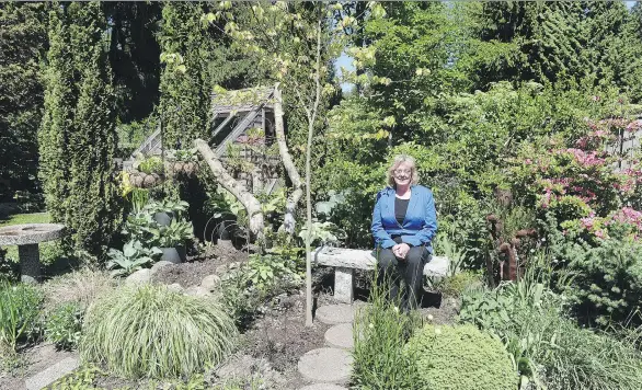  ?? PHOTOS BY NICK PROCAYLO ?? Delphia Johnstone in her magnificen­t garden, one of the true highlights on the Art in the Garden Tour planned for Vancouver’s North Shore later this month.