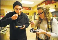  ?? Brian A. Pounds / Hearst Connecticu­t Media ?? Siblings Andrew and Amanda Ciarlelli, of Watertown, eat at the Barone Campus Center Dining Hall at Fairfield University. Sen. Will Haskell, D-Westport, said there’s been a growing problem of college-aged people not having access to a “sufficient quantity of affordable, nutritious food.”