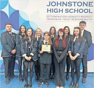  ?? ?? Accolade Pupils and staff at Johnstone High School are celebratin­g after gaining Gold SCQF School Ambassador status