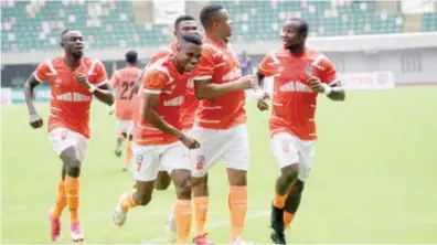  ?? ?? Akwa United defender, Charles Okafor (2nd R) celebrates the opening goal with his team mates during yesterday’s week 6 match against Katsina United in Uyo