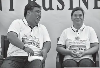  ?? MACKY LIM ?? LIGHT MOMENT. Davao City Mayor Sara Duterte is caught in a light moment with Davao Occidental Governor Claude Bautista during yesterday’s groundbrea­king of the soon-to-rise Davao Occidental Provincial Capitol and Government Business Center in Barangay...