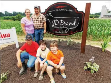  ?? PHOTOS BY LISA MITCHELL — DIGITAL FIRST MEDIA ?? Jill and Dave Kopfer, Blandon, were named 2016Berks County Outstandin­g Farm Family by the Reading Fair and Berks County Pomona Grange. In front are their sons Austin, 12; Clayton, 6; and Colton, 4.