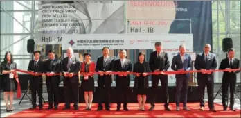  ?? PROVIDED TO CHINA DAILY ?? Officials and guests at a ribbon-cutting ceremony at the opening of the 18th annual China Textile and Apparel Trade Show at the Javits Convention Center in New York. Among them are Zhang Qiyue (fifth from right), Chinese consul general of New York; Xu...