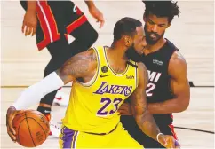  ?? Kevin C. Cox / Gett y Imag es ?? Miami’s Jimmy Butler, here defending L.A.’S Lebron
James, says Miami’s confidence will “have to be at an all-time high” to rebound from a 3-1 series deficit.