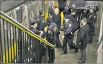  ?? ?? GUNPLAY: Police flood Ralph Avenue station on the C line Tuesday after two people were shot inside the train.