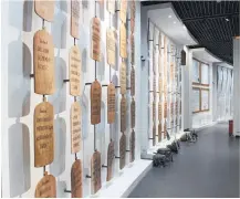  ??  ?? Above, a wall of Quranic inscriptio­ns hangs in a gallery dedicated to Abrahamic religions in Africa.