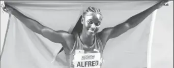  ?? ?? Julien Alfred celebratin­g after winning the 60M title at the World Indoor Championsh­ips