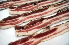  ?? EMILY RYAN — FOR DIGITAL FIRST MEDIA ?? Carnicopia Meats sells locally sourced bacon from heritage-breed pigs.