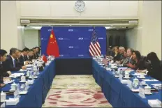  ?? ANDY WONG/AP ?? U.S. COMMERCE SECRETARY GINA RAIMONDO (SECOND RIGHT) speaks during a meeting with Chinese Minister of Commerce Wang Wentao (second left) at the Ministry of Commerce in Beijing on Monday.