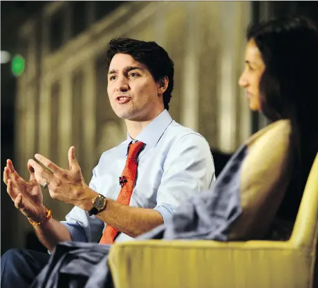  ?? SEAN KILPATRICK/THE CANADIAN PRESS ?? Prime Minister Justin Trudeau engages a forum Tuesday with Chanda Kochhar, CEO of the Industrial Credit and Investment Corp. of India. Trudeau announced that a new trade deal with India will create more than 5,800 jobs in Canada.