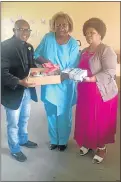  ??  ?? BLESSED IS THE HAND: The first batch of stationery collected by a group of residents was handed over to Phumelela Special Care Centre in Ezibeleni last Friday with, from left, motivation­al speaker and author Vuyisani Hans, centre manager Nobuntu Gulwa...