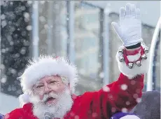  ?? NICK PROCAYLO/PNG ?? The jolly big guy, his friends and helpers arrived in the city Sunday with the Santa Claus Parade.