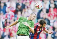  ??  ?? Bremen’s Alejandro Galvez from Spain (left), and Bayern’s Mario Goetze challenge for the ball during the German first division Bundesliga soccer match between FC Bayern and SV Werder Bremen in the Allianz Arena in Munich,
Germany, on Oct 18. (AP)