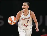  ?? David Becker/Associated Press ?? Mercury guard Diana Taurasi calls a play as she brings the ball up court against the Aces during the second half of Game 2 in the semifinals of the WNBA playoffs in 2021 in Las Vegas. Taurasi has re-signed with the Mercury, agreeing to a multiyear contract on Saturday, the team announced.