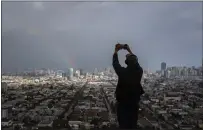  ?? LOREN ELLIOTT — THE NEW YORK TIMES ?? A rainbow over San Francisco in February. Before the state's rainy season ends Sunday, another storm is headed for California.