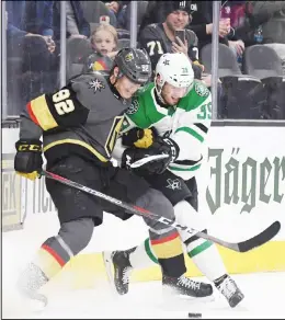  ??  ?? Tomas Nosek #92 of the Vegas Golden Knights and Joel Hanley #39 of the Dallas Stars fight for the puck in the second period of their game at T-Mobile Arena on Dec 9in Las Vegas, Nevada. (AFP)