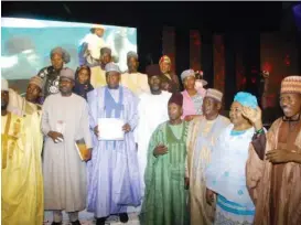  ?? ?? Governor Zulum’s chief of staff, Professor Isa Hussaini Marte (in sky blue) accompanie­d by some citizens of Borno State living in Lagos, when he represente­d Zulum at the 19th Sun awards, held Saturday night in Victoria Island, Lagos.