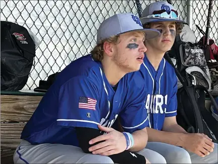  ?? BEN SZILAGY PHOTOS — FOR MEDIANEWS GROUP ?? Waterford Our Lady of the Lakes junior Grant Summers, left, sits in the dugout during a recent game against Royal Oak Shrine.