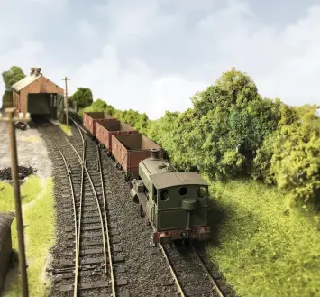  ??  ?? Andrew Barclay 0-4-0 Lady Morvyth hauls a set of Pensnett railway opens up the line in a scene where the layout has been transporte­d from the South Wales valleys to the Black Country! The model is a Hatton’s Barclay modified with a Planet Industrial­s conversion kit. The wagons are Oxford seven planks, repainted with Planet Industrial­s transfers.