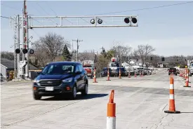  ?? BILL LACKEY / STAFF ?? Some lanes were reopened on Ohio 41 near the Clark County Fairground­s, in Springfiel­d Twp., on Wednesday. The road had been closed since a train derailment on Saturday.