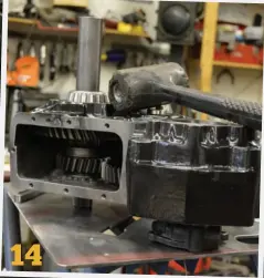  ??  ?? 14
AA includes a piece of tubing to help press the final output shaft bearing on. The shaft and gears must be installed in the case, and then you can press the bearing in.