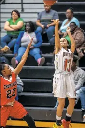  ??  ?? Potomac’s Aliyah Bullock (North Point) launches a three-point attempt with Chesapeake’s Aleta Plater (Chopticon) in Friday night’s SMAC senior all-star girls basketball game at North Point High School in Waldorf. Bullock finished with 15 points in a...