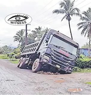  ?? Picture: SUPPLIED ?? A ten-wheeler truck slipped into a drain along Tokotoko Back Rd in Navua on Friday morning.