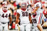  ?? COURTESY OF TONY WALSH ?? Defensive tackle Jalen Carter (88) made some significan­t plays in Georgia’s 33-18 victory over Alabama in the College Football Playoff Championsh­ip game, including a blocked field-goal attempt.