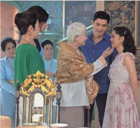  ?? WARNER BROS. PICTURES ?? Michelle Yeoh, Gemma Chan and Lisa Lu star as Nick Young’s (Henry Golding) “Crazy Rich Asians” family keen to meet his girlfriend.