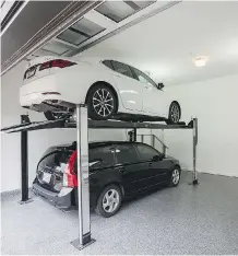  ??  ?? The double garage is tall enough to handle a car lift in Ultimate Renovation’s Edgemont showcase home.
