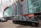  ?? Photograph­y/Shuttersto­ck ?? Sir Bobby Charlton’s hearse passes Old Trafford, where hundreds of fans gathered to pay their respects. Photograph: Gary Roberts