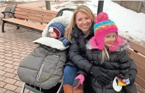  ?? PHOTOS BY CRAIG GILBERT / MILWAUKEE JOURNAL SENTINEL ?? Democrat Meg Kurlinski, with her children at the Cedarburg Winter Festival, says she has been "consistent­ly disappoint­ed and just saddened" by President Donald Trump's rhetoric and performanc­e in office. Her suburban community, Whitefish Bay, saw the...