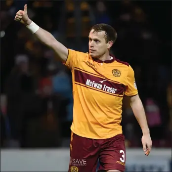  ??  ?? Motherwell’s Steven Hammell waves to the fans after the derby victory over Hamilton Accies