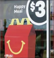  ?? ROGELIO V. SOLIS — THE ASSOCIATED PRESS ?? A $3 Happy Meal is advertised Wednesday at a McDonald’s restaurant in Brandon, Mississipp­i.