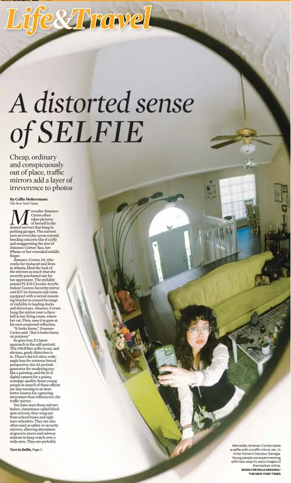  ?? MARILYNE MOJA MWANGI/ THE NEW YORK TIMES ?? Mercedes Jimenez-Cortes takes a selfie with a traffic mirror Jan. 14 in her home in Decatur, Georgia. Young people are experiment­ing with new ways to warp images of themselves online.