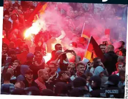  ?? Picture: ?? Running riot: Angry mobs on the streets of Chemnitz