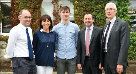  ??  ?? Denis Doolan guest Speaker and Sean Coffey Principal (right) with Conor O’Donoghue who received the St Brendan’s Golf Medal for Academic Excellence and Bishop Ó ßúilleabhá­in Memorial Award for outstandin­g achievemen­t in Irish with his parents Mike and...
