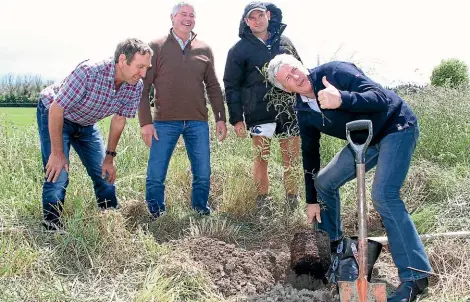  ?? STUFF ?? FROM LEFT: Lowther Downs owner Laurie Selbie, Thriving Southland chairman Ewen Mathieson and Rob Selbie watch Agricultur­e Minister Damien O’Connor plant a tree to signify the launch of the Thriving Southland Change and Innovation Project at Five Rivers earlier this month.