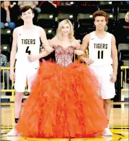  ??  ?? Freshman maid, Madison Dye, daughter of Donny and Jackie Dye, escorted by Noah Ceniceros, son of Steve and Stephanie Ceniceros; and Josh Rubin, son of Shannon Wolf.