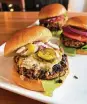  ?? GRETCHEN MCKAY/PITTSBURGH POST-GAZETTE/TNS ?? Roasted black beans and toasted cashews team up with chipotle chili pepper to create this really awesome veggie burger.