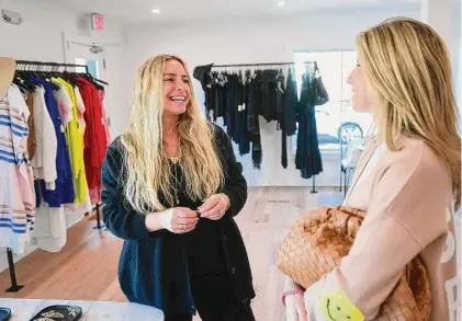  ?? Brian A. Pounds/Hearst Connecticu­t Media ?? Vanessa Lewis, left, owner of Penfield Collective, a new store selling laid-back luxury apparel, chats with customer and fellow business owner Shana Swanson at the store in Westport on March 9.