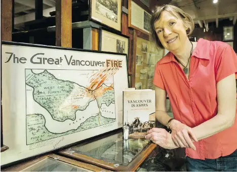  ?? ARLEN REDEKOP ?? Lisa Smith displays a copy of her book Vancouver is Ashes at the Hastings Mill Store Museum, where this Saturday they’ll honour the First Nations “first responders” who helped save the city’s earliest residents from almost certain death during the Great Fire of June 13, 1886.