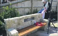  ?? FM4406520 / FM4406538 ?? Aldington Primary School pupils place crosses at the memorial; right, Shirley Moss unveils the 59th (Newfoundla­nd) Heavy Regiment, Royal Artillery, seat of remembranc­e