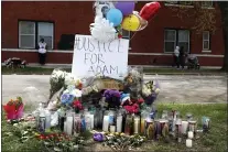  ?? SHAFKAT ANOWAR - THE ASSOCIATED PRESS ?? A memorial near the spot where 13-year-old Adam Toledo was shot by a police officer in Chicago’s Little Village neighborho­od, Friday, April 16, 2021, a day after the body camera video was release of the fatal shooting.