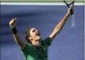  ?? MARK J. TERRILL — THE ASSOCIATED PRESS ?? Roger Federer celebrates his win against Stan Wawrinka in the final of the BNP Paribas Open Sunday.