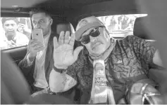  ??  ?? Argentine football star Diego Maradona waves inside a car upon his arrival at the internatio­nal airport in Culiacan, Sinaloa state, Mexico on September 8, 2018. - Maradona is expected to be presented as new team coach of Mexican second-division club Dorados on Monday. - AFP photo